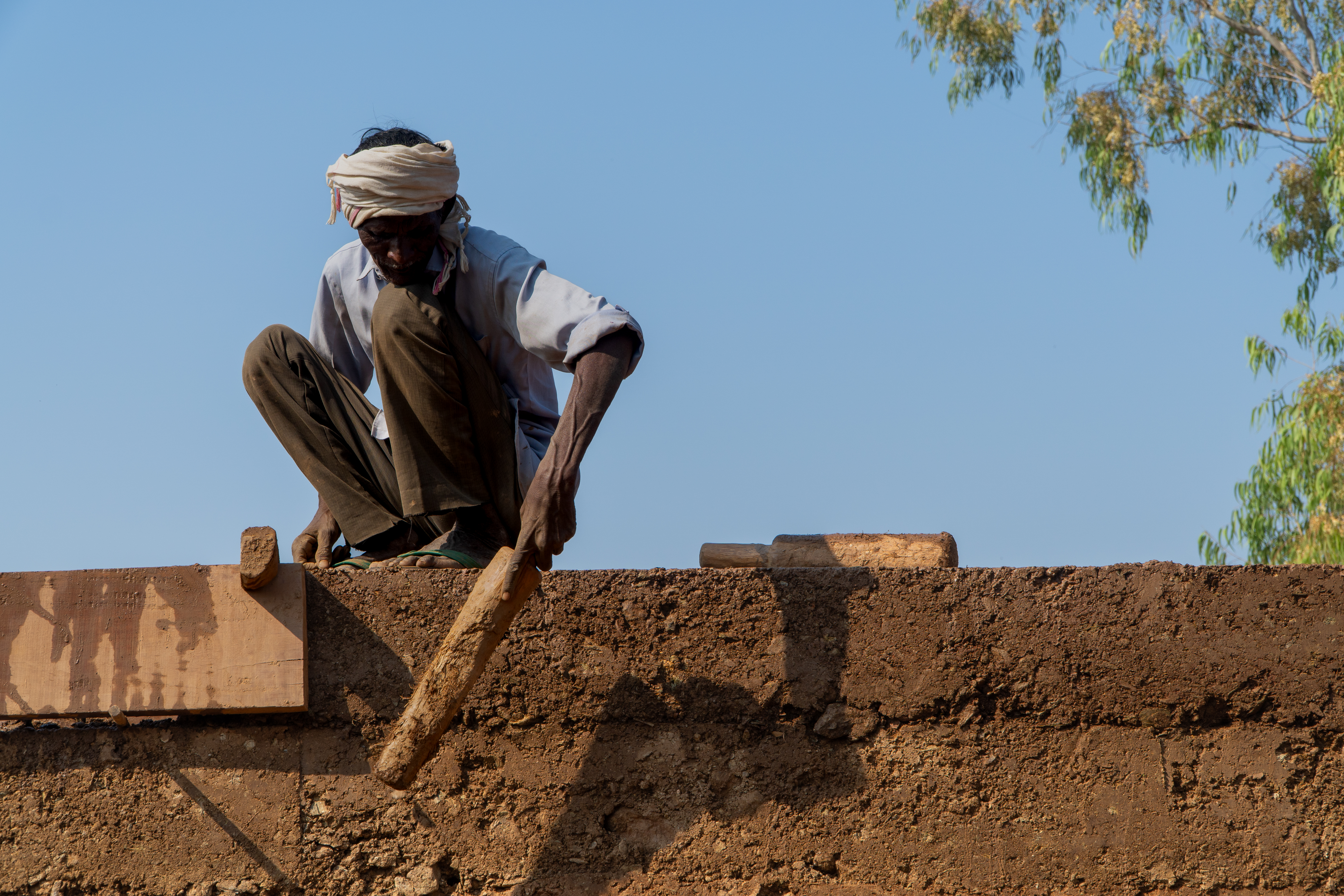 Hands That Create – Rammed earth wall construction